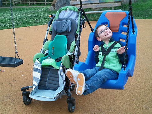 Boy playing on a swing